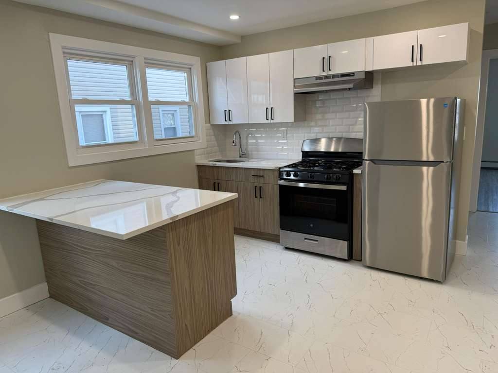 Kitchen with wall and base cabinets